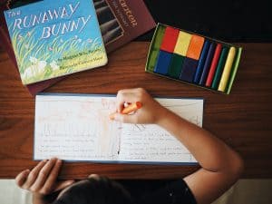 Student writing in a main lesson book